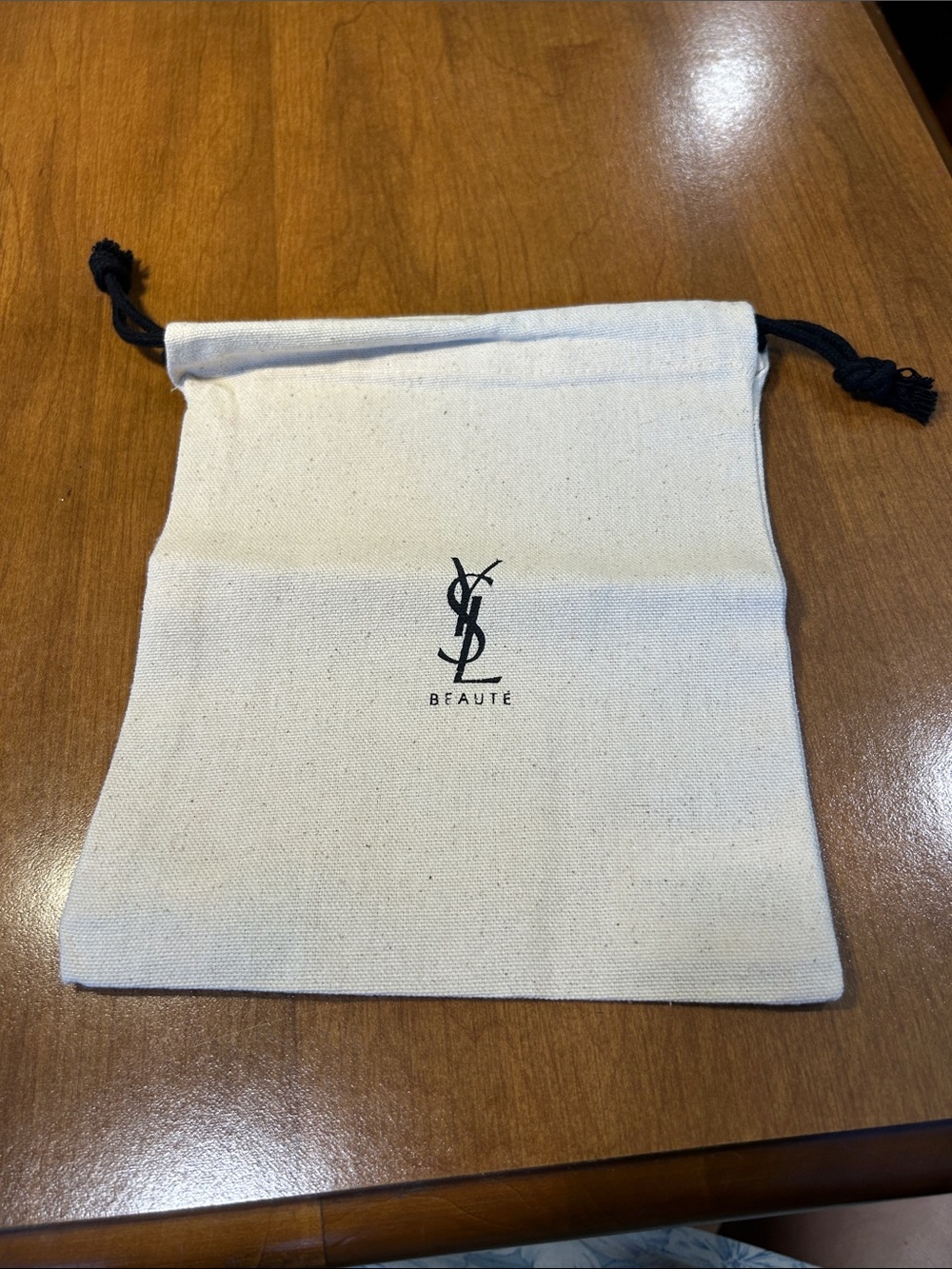 Yves Saint Laurent Neutral Canvas Drawstring Pouch with Black Logo